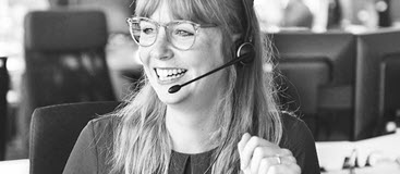 Lady wearing headset in a call centre